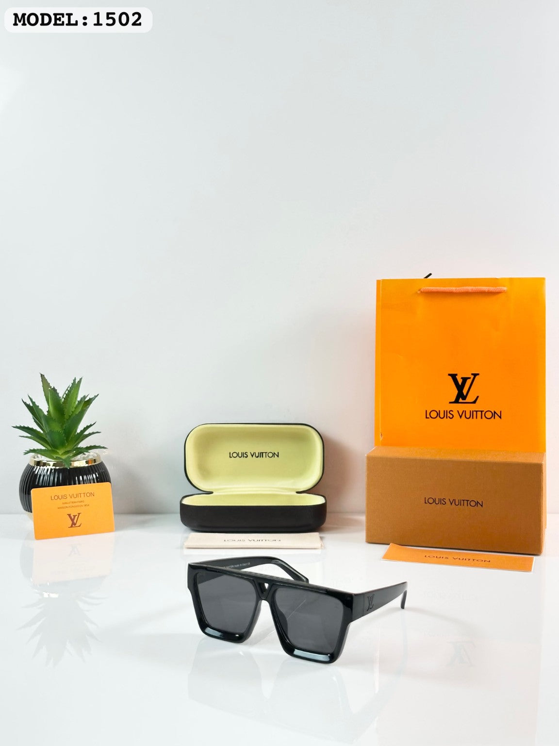 Louis Vuitton sunglasses with glossy black rectangular frame and dark lenses