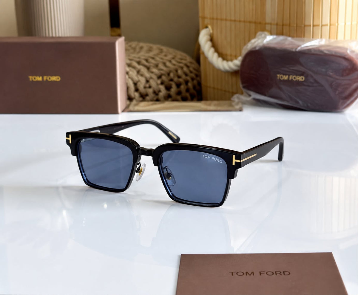 Tom Ford unisex black metal frame sunglasses with blue fiber lenses
