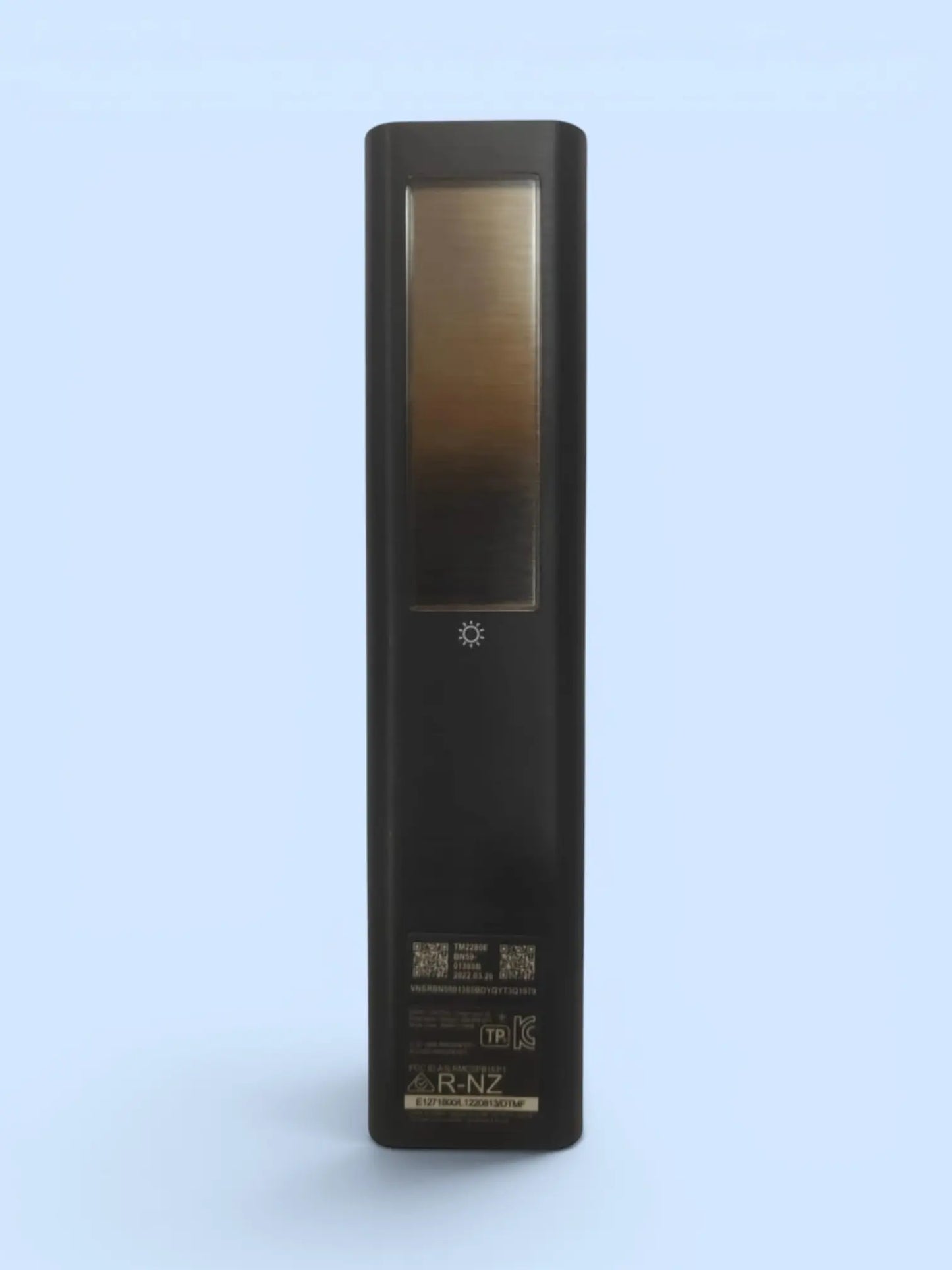 Black electronic device with a reflective surface on a light blue background