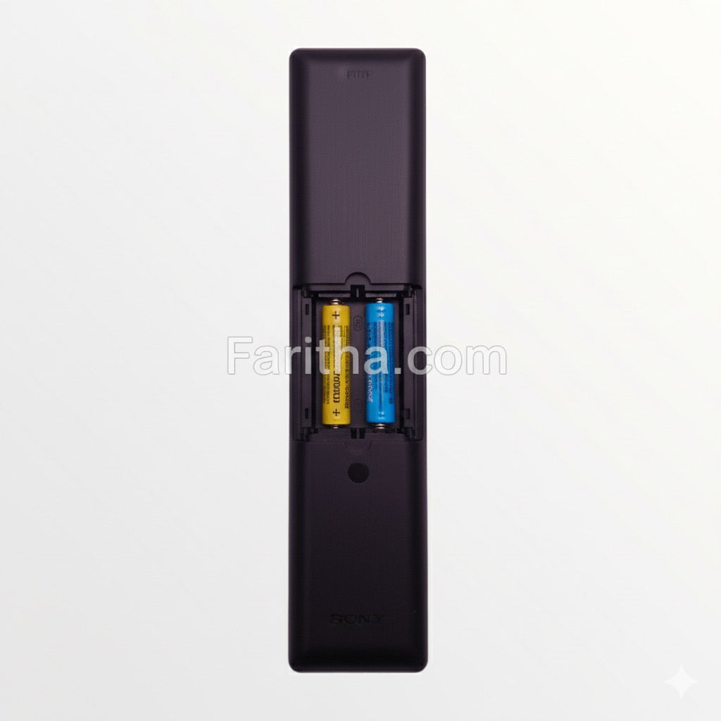 Black remote control with battery compartment on a white background