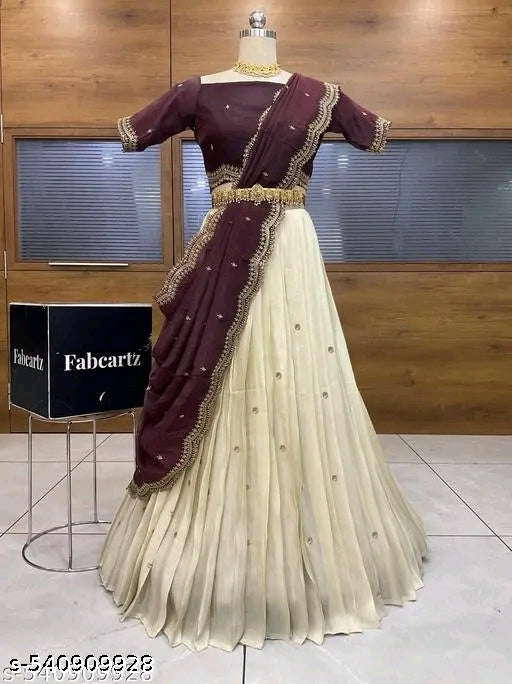 Maroon and beige saree on a mannequin with Fabcartz box in the background