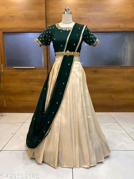 Green and beige traditional outfit on a mannequin against a wooden background