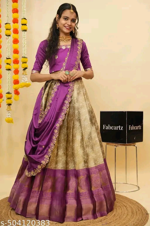 Woman in a purple and beige traditional outfit with 'Fabcartz' branding in the background.