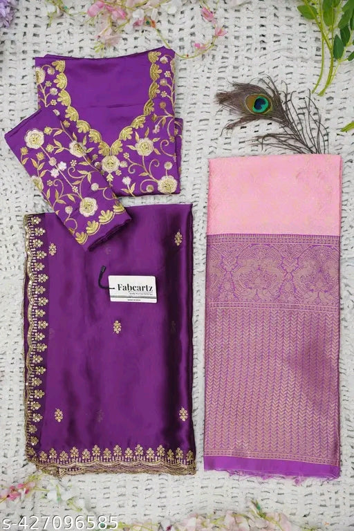 Purple saree with floral embroidery and pink blouse on a white background