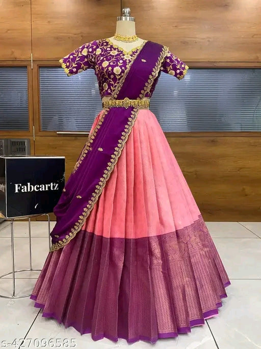 Purple and pink traditional outfit on a mannequin with Fabcartz branding in the background.