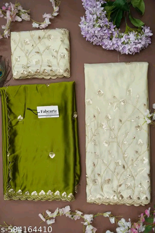 Green fabric with embroidery and a Faberlic tag on a brown background