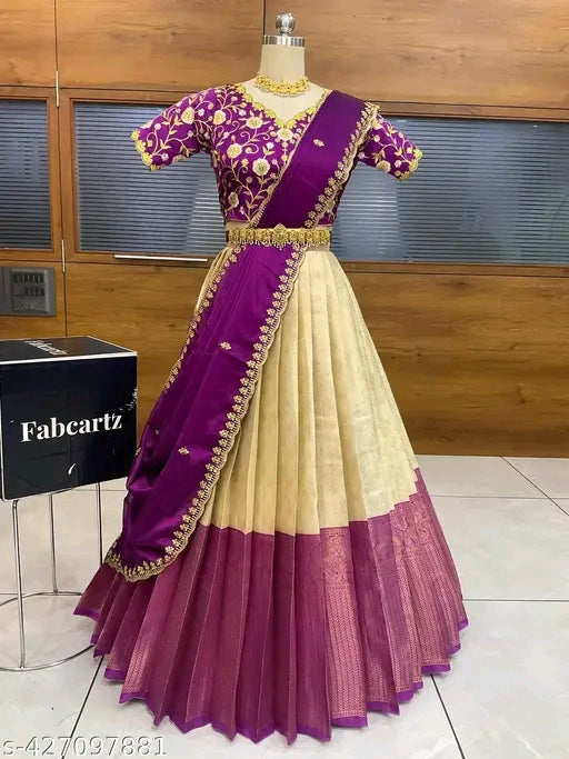 Purple and beige traditional outfit on a mannequin with Fabcartz box in the background.