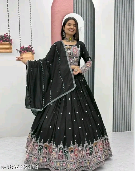 Woman wearing a black embroidered traditional outfit with a white background