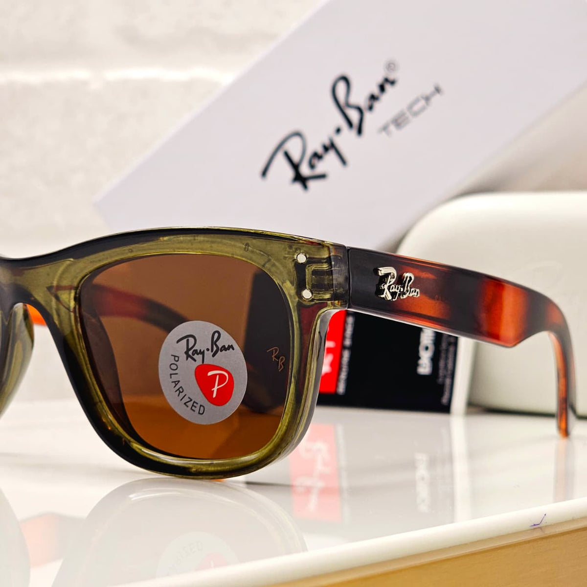 Rayban sunglasses close-up showing brown translucent frame and polarized lenses