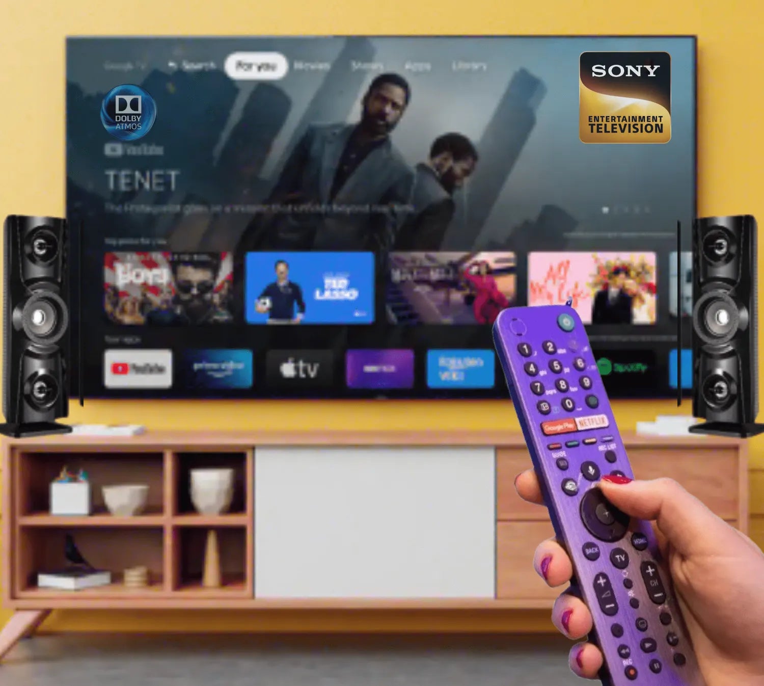 User operating Sony Smart TV with purple voice remote in front of streaming