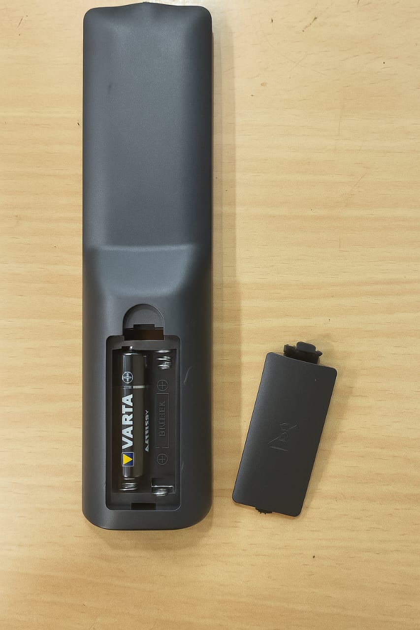 VU LED TV Remote back view — battery compartment, 2 AAA batteries, compatible replacement India
